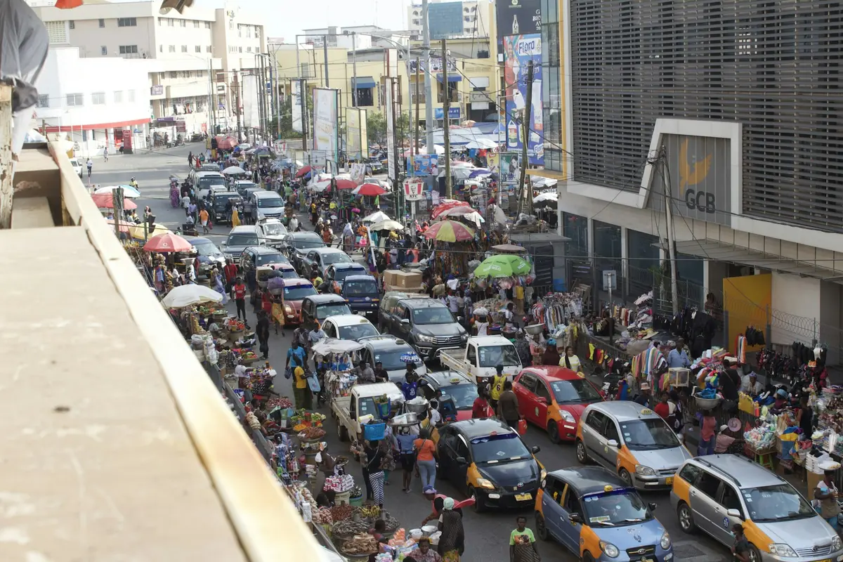 Heavy traffic and taxis on a busy street in central Accra