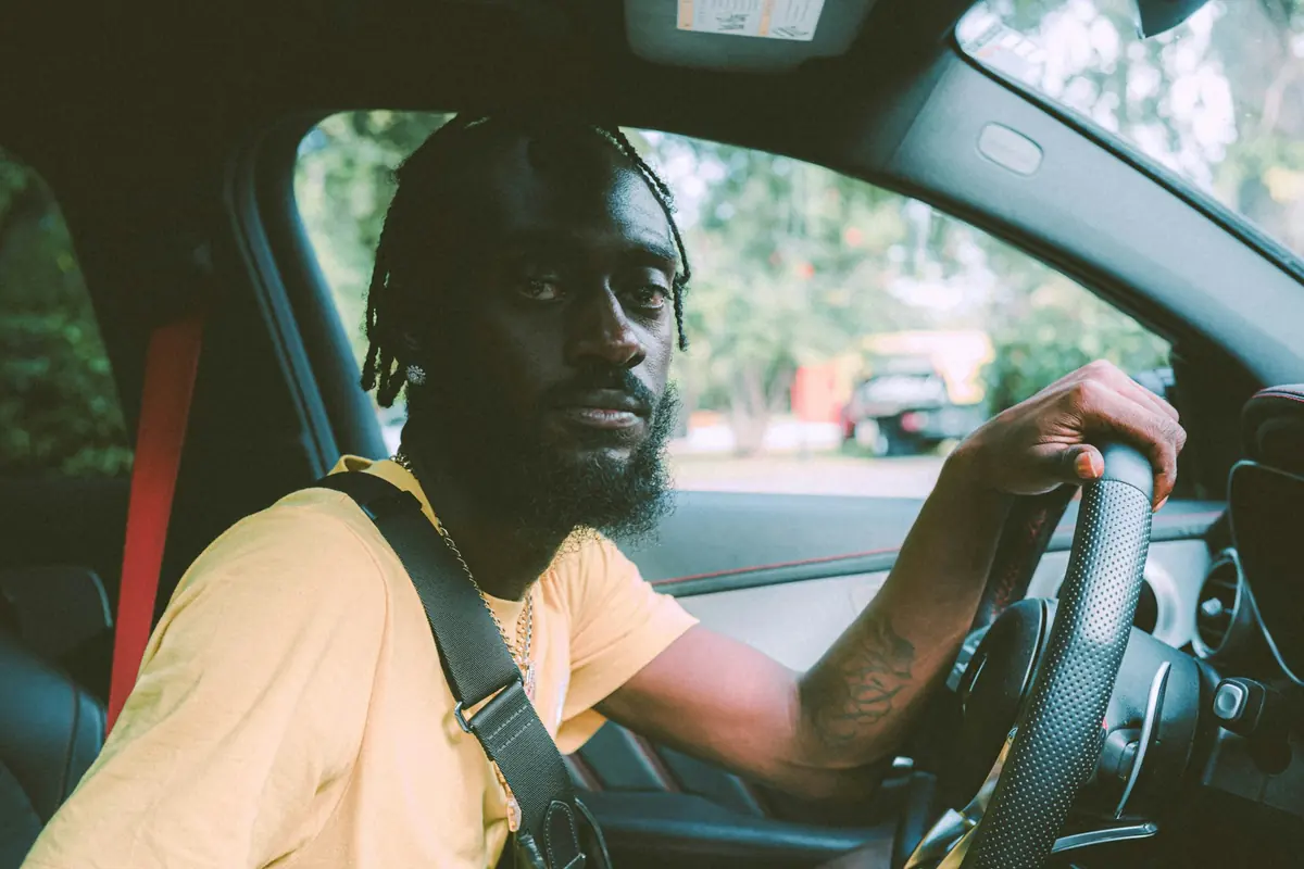 Man driving a rental car himself in Ghana
