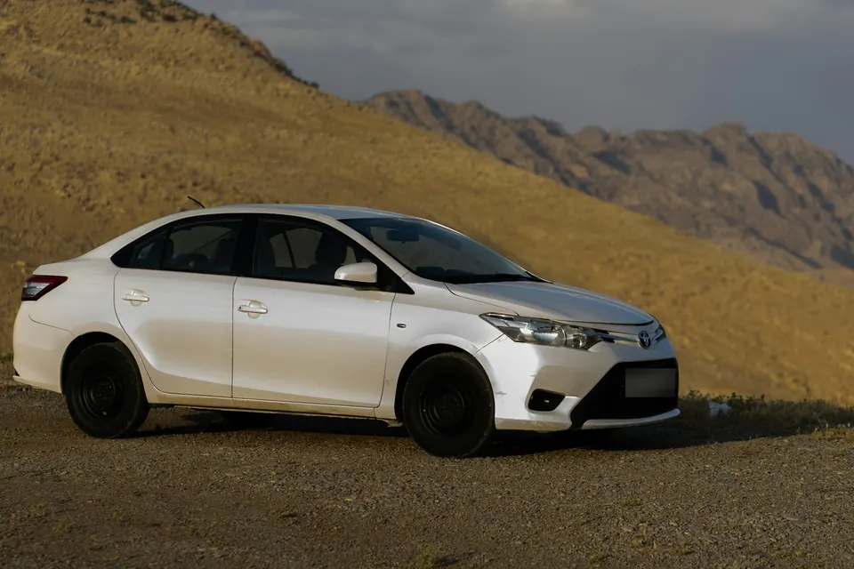 White Toyota Yaris economy car for rent in Ghana